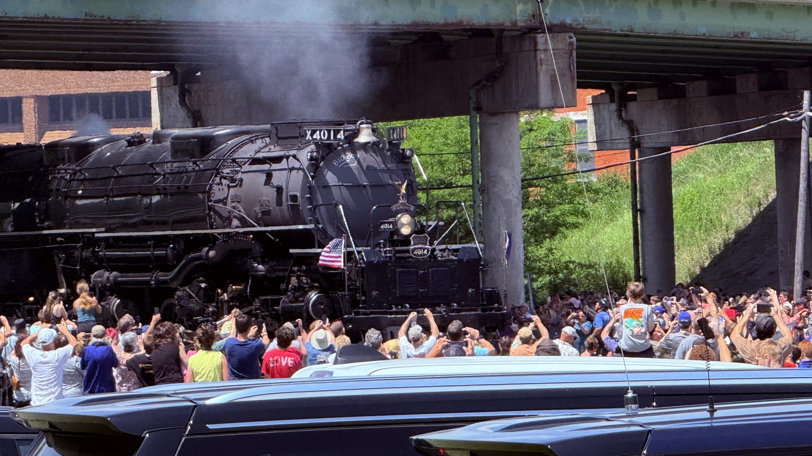 Union Pacific Big Boy No. 4014 — the largest steam locomotive ever built — rolling through Hornell, flag flying.